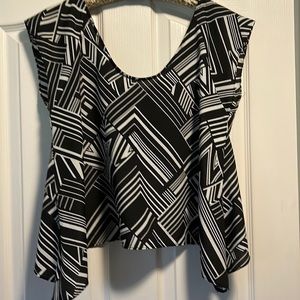 Women top.100% polyester. Open in the back.